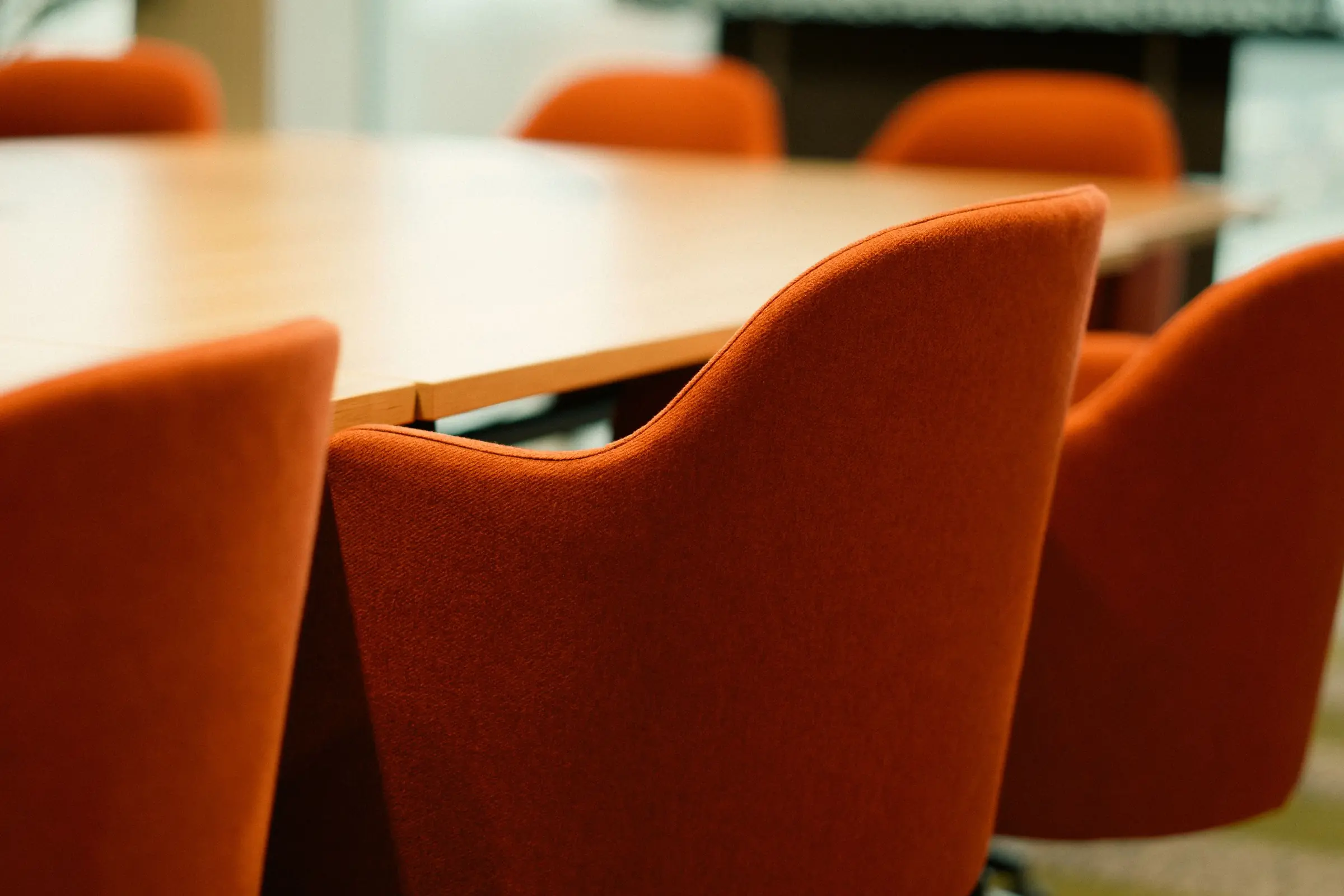 Meeting table with orange chairs