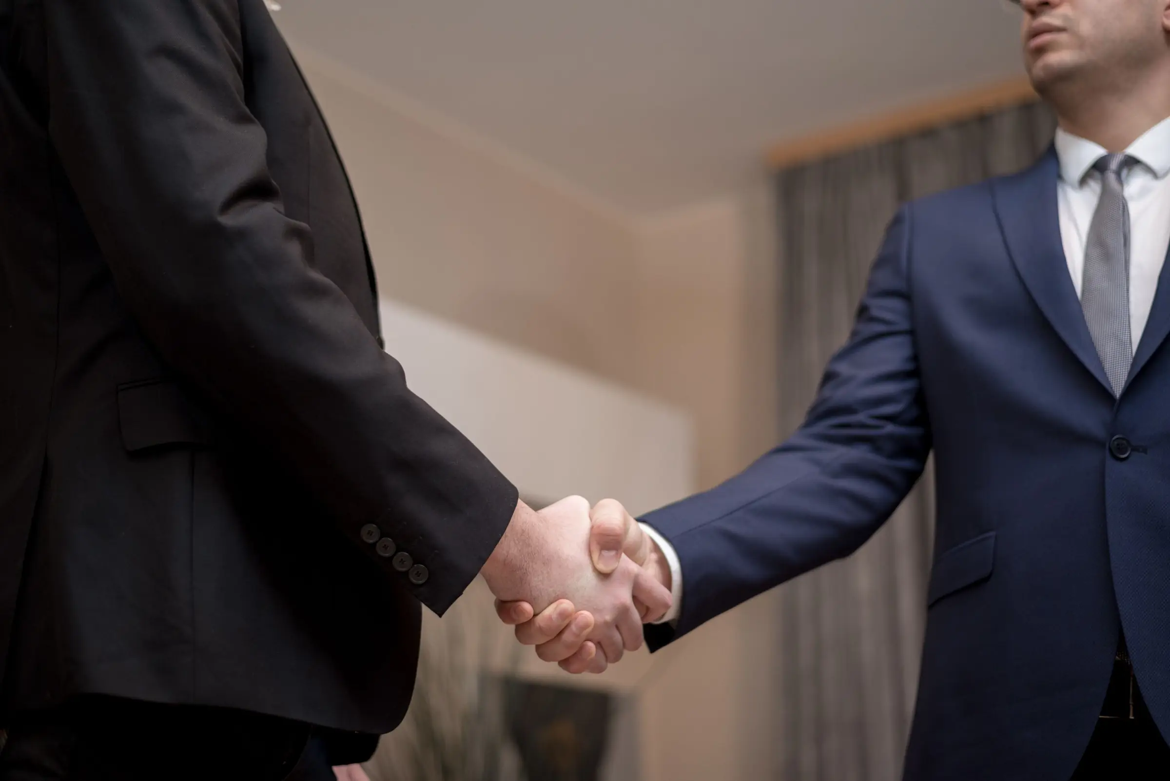 Two business people shaking hands