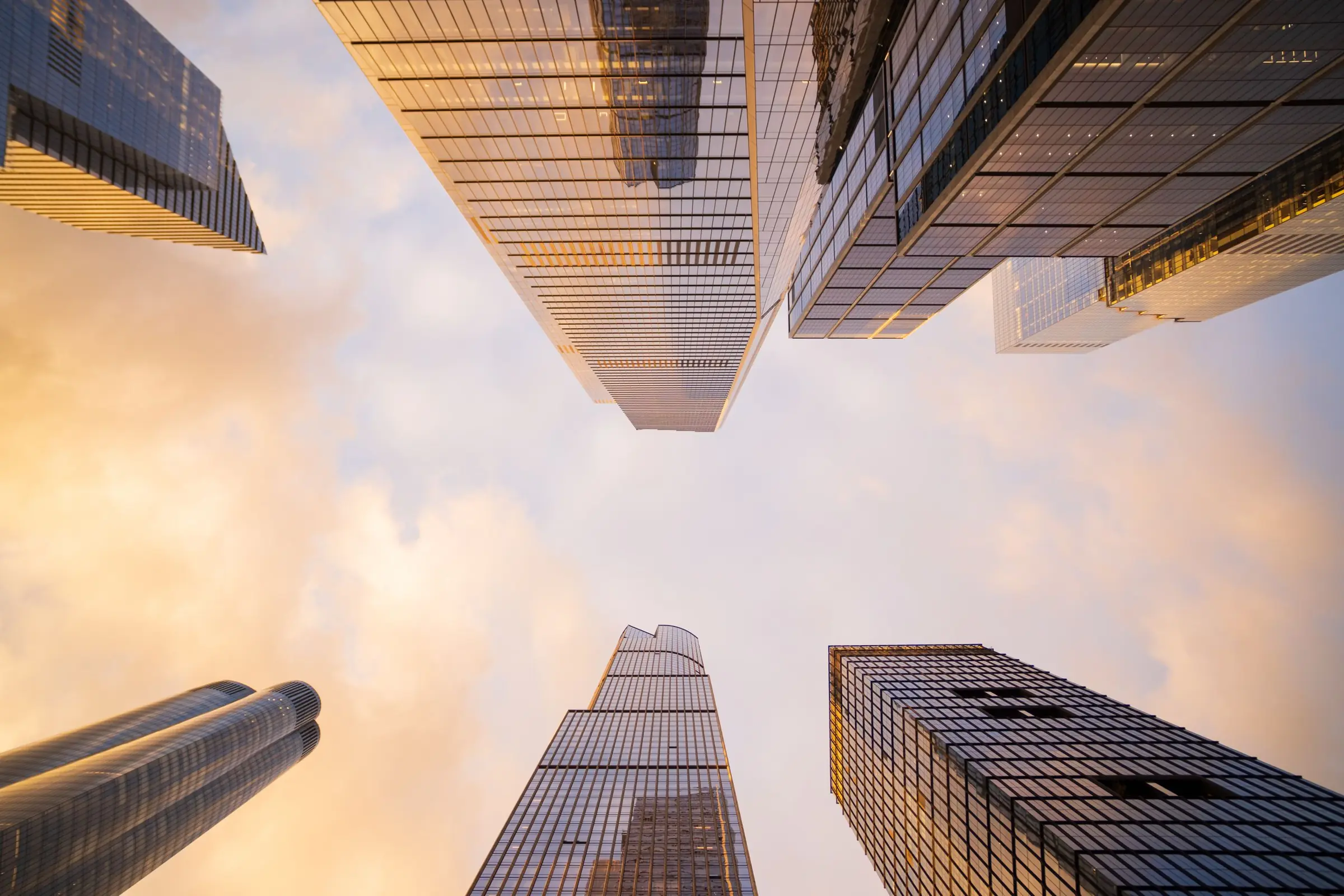 High-rise buildings from below in evening light